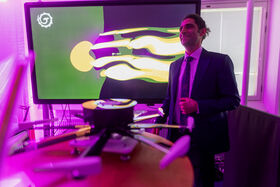 A startup founder behind their product at Demo Day 2025 - Aalto Startup Center