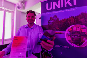 A startup founder showcasing their product at Demo Day 2025 - Aalto Startup Center